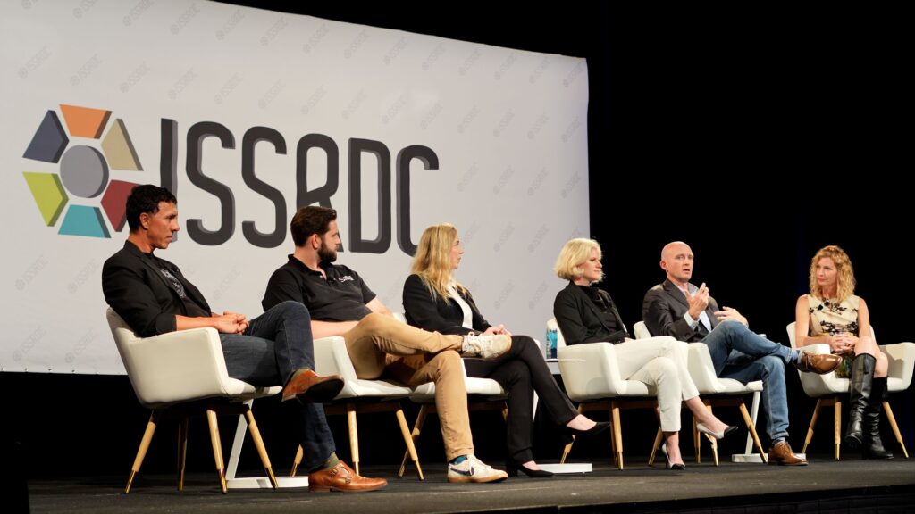 Photo of Elizabeth Reynolds moderating the “Innovating in the Space Landscape" panel discussion at the International Space Station Research and Development Conference